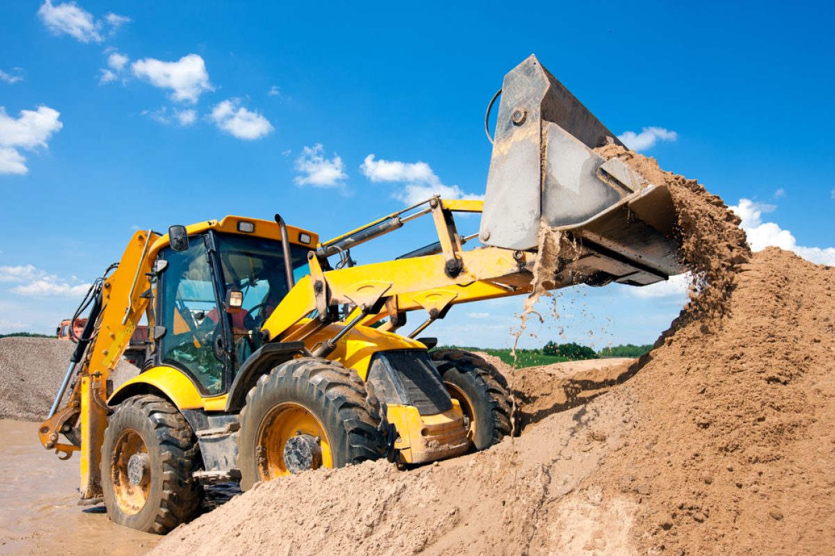 Wheel,Loader,Excavator,Unloading,Sand,With,Water,During,Earth,Moving